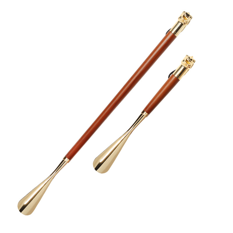 Suministro de haya nuevo estilo caballo dedo del pie del zapato Extractor de zapatos de metal zapato extractor alargado León dedo del pie del zapato de regalo de gama alta