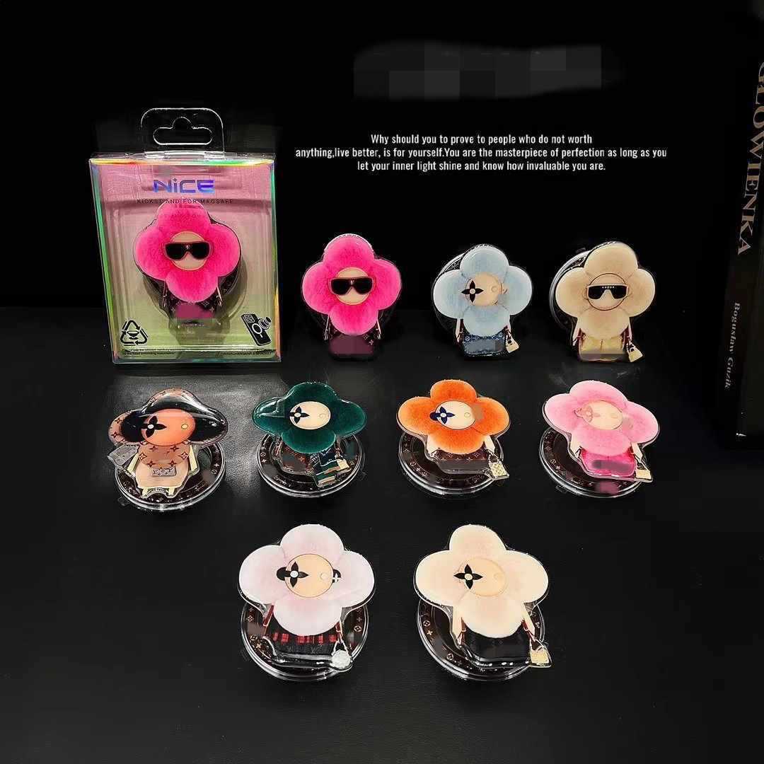 新型高級マグネットスタンドマグネット式携帯ケース通用太陽花マグネット式エアバッグスタンドはおしゃれで豪華です。