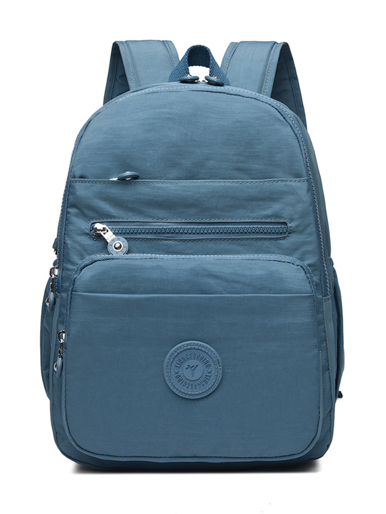Mochila de hombro de comercio exterior 2025, nueva mochila de computadora simple de color sólido, mochila de escuela secundaria, mochila para hombres y mujeres.