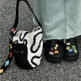韩系慵懒风帆布包包女可爱卡通黑猫水桶包松弛感百搭单肩斜挎包潮