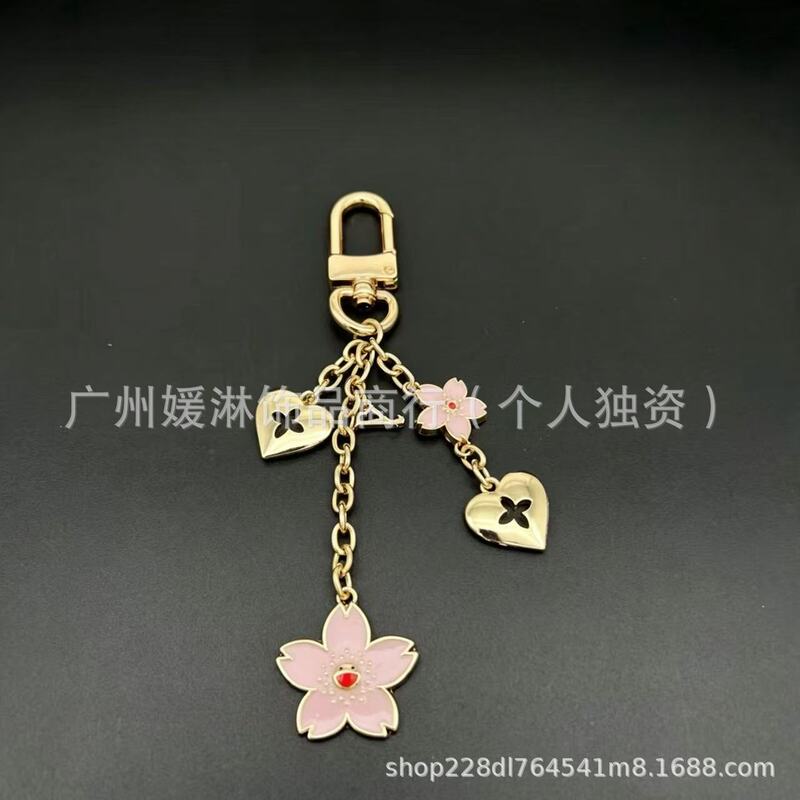 Foreign trade Murakami Takashi cherry blossom bag accessory with pink enamel cherry blossom pendant, heart pendant, cross-border keychain
