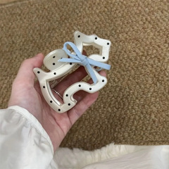 かわいい蝶結びの波の点の子犬のつかみのヘアピンの新型の韓国系の半はサメの魚を刺して甘い髪飾りを挟みます。