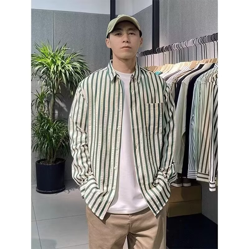 Camisa de rayas negras 2025 primavera ropa de hombre nuevo temperamento de alta gama camisa de manga larga suelta