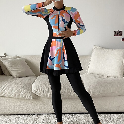 Muslim swimwear with random graphic prints: conservative, full-coverage three-piece set featuring long-sleeve one-piece tops and long pants with shorts.
