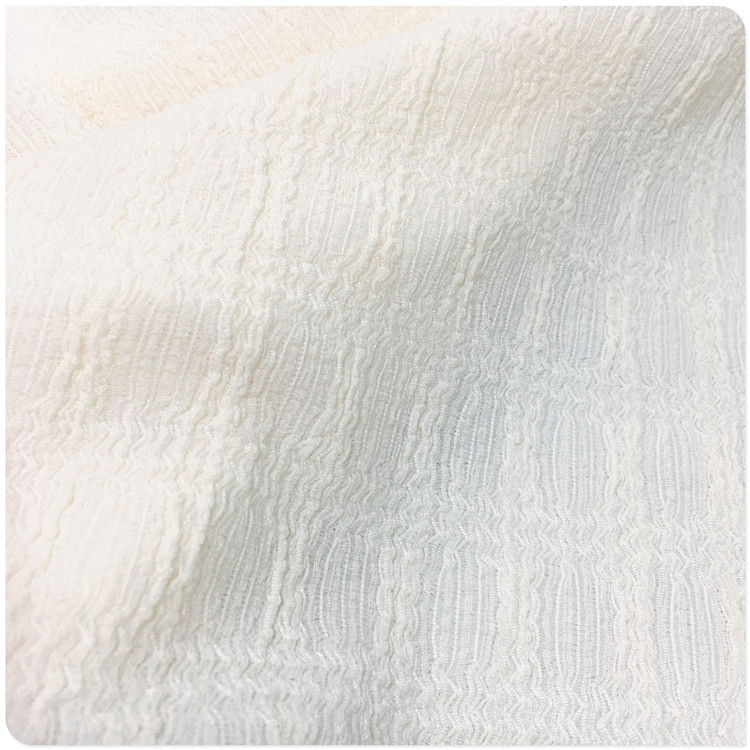 厂家供应经编花式压绉花边布交织氨纶提花泡花立体纹理日韩女面料