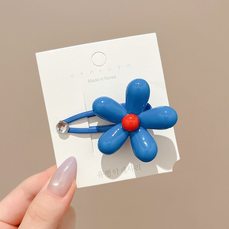 1# blue floral hair clip, approximately 5cm in length, with a flower head of about 4cm