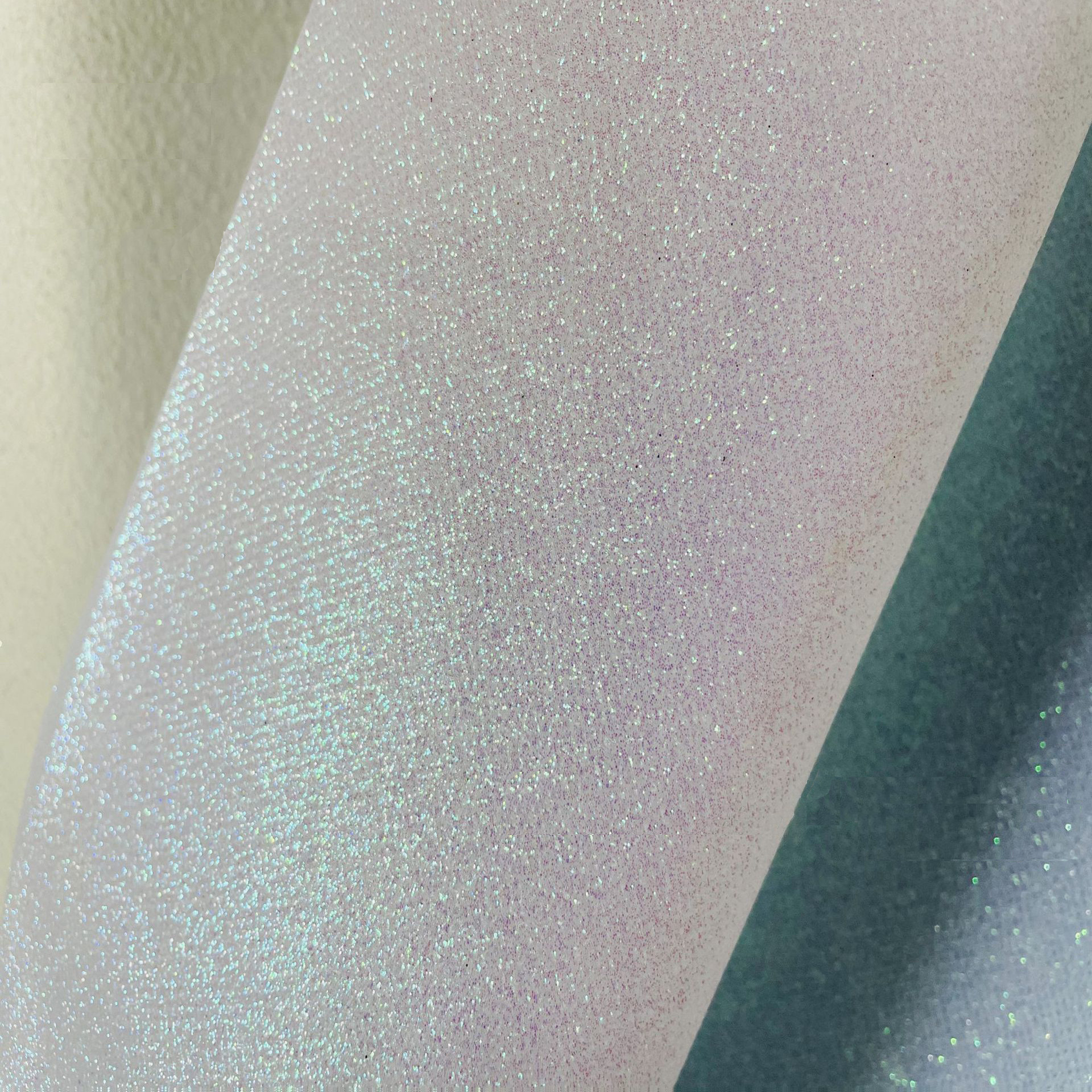 Suministro directo de fábrica de tela no tejida Glite Brillante Tela de lentejuelas Estuche para teléfono móvil Bolsa de cosméticos Accesorios para el cabello Decoración de ropa