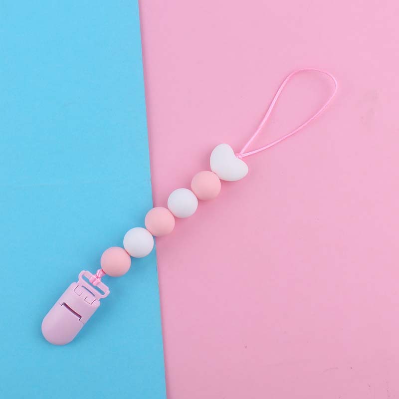 Nuevo bebé suministros de dibujos animados amor silicona DIY creativo macaron color serie mordedura cola molar pezón