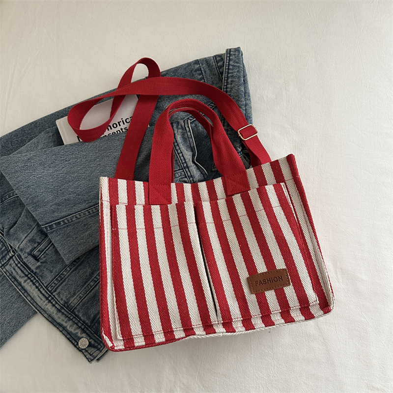 Bolsas de gran capacidad de transporte 2024 nuevas bolsas de mujer populares bolsas de lona a rayas bolsas de mochilas de moda bolsas de mano