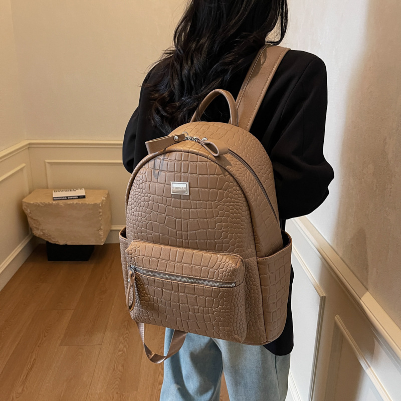 Moda coreana mochila de cuero suave para mujeres 2025 nuevo comercio exterior mochila de gran capacidad simple bolsa de viaje ligera