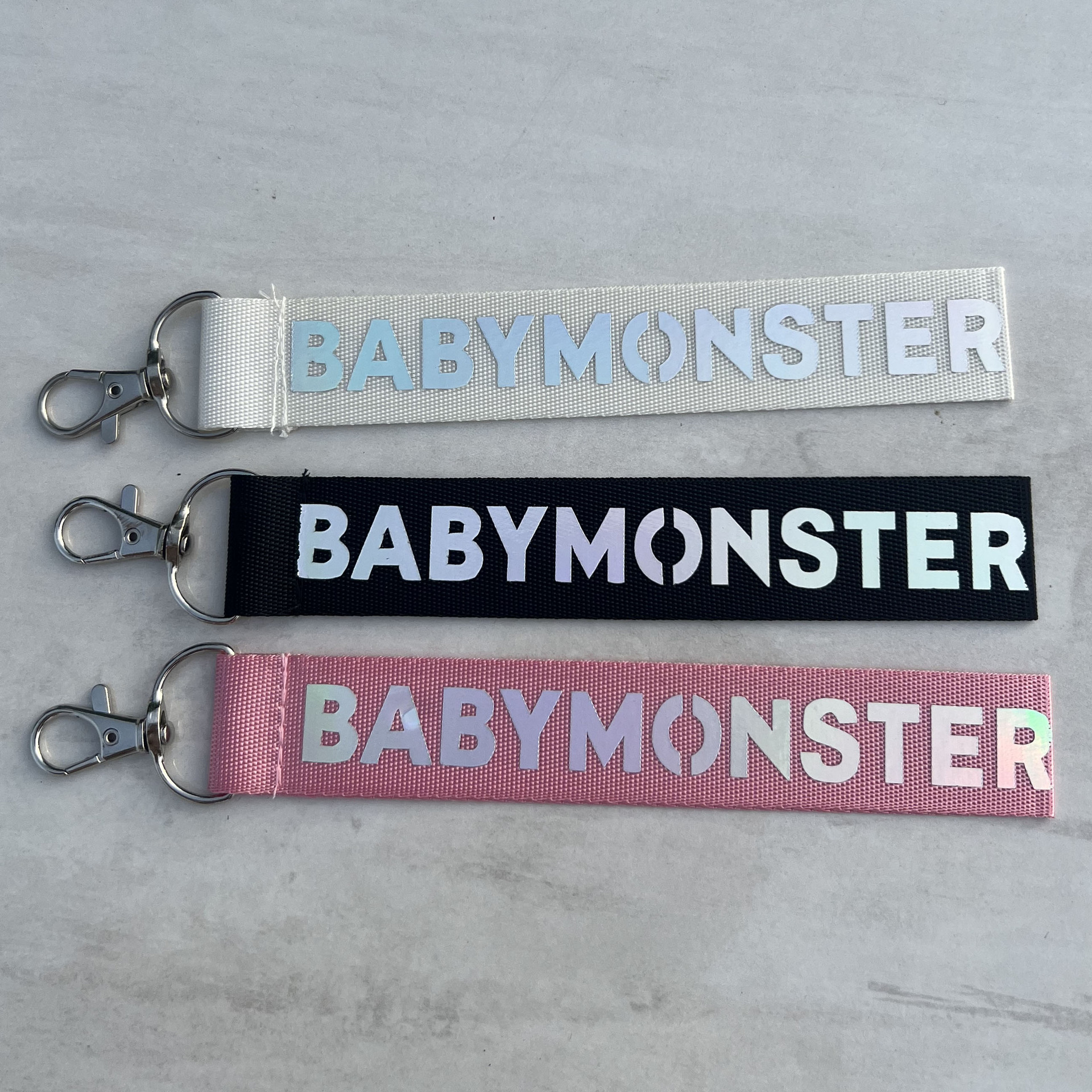 BABYMONSTER Combinación de cuerda láser periférica para teléfonos móviles llavero BABY MONSTER
