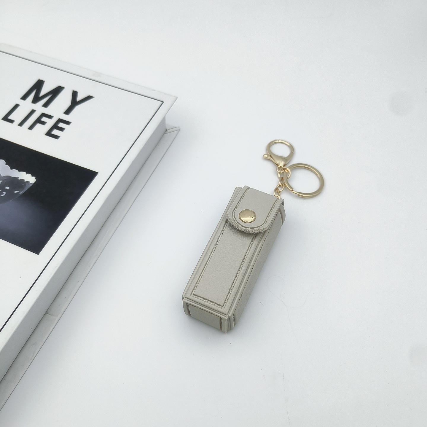 Bolso de cambio transfronterizo sobre rojo espejo creativo llavero colgante pequeño PU cuero bolso de coche accesorios accesorios en stock