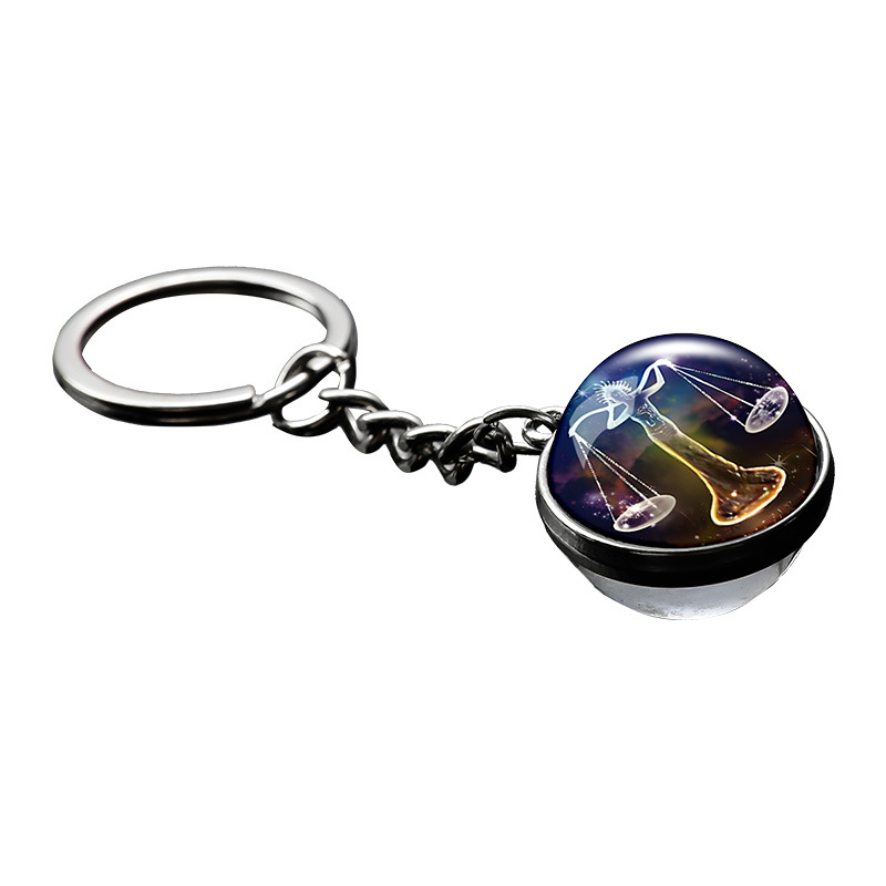 Transfronterizo 12 constelaciones de luz nocturna bolsos colgantes de bolsas de joyas de tiempo doble cara bola de vidrio llavero al por mayor