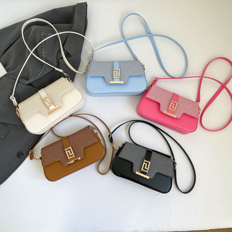 Nicho de diseño de alta sensación de silla de montar bolso para mujeres 2026 nuevo estilo coreano simple brazo de moda de hombro pequeño bolso