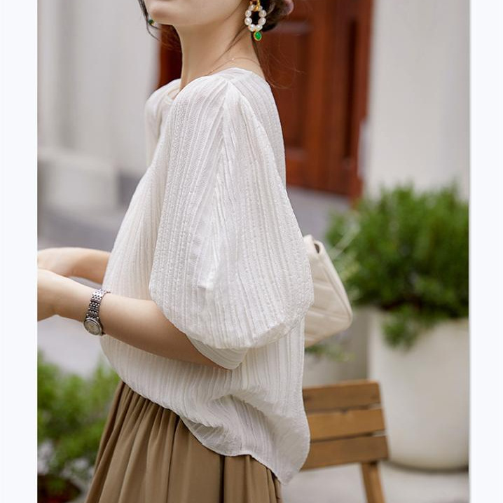Elegant silk shirt with a round collar