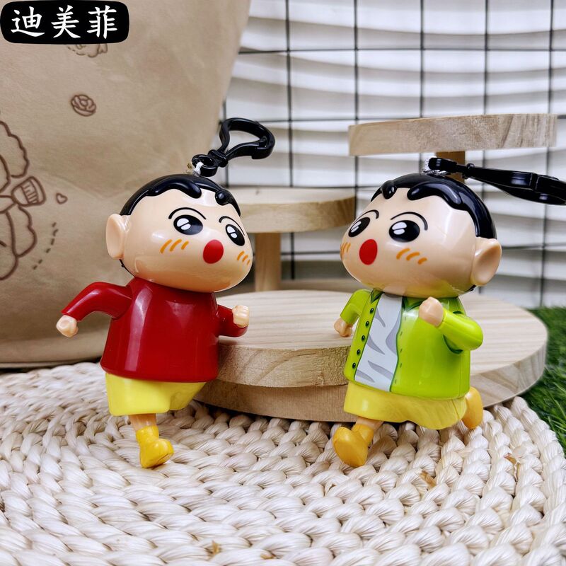 爆発的な創造的なアニメランニングのしんちゃんがかわいい線を引いた学生カップルのアニメの鍵玩具ストラップが解凍された|undefined