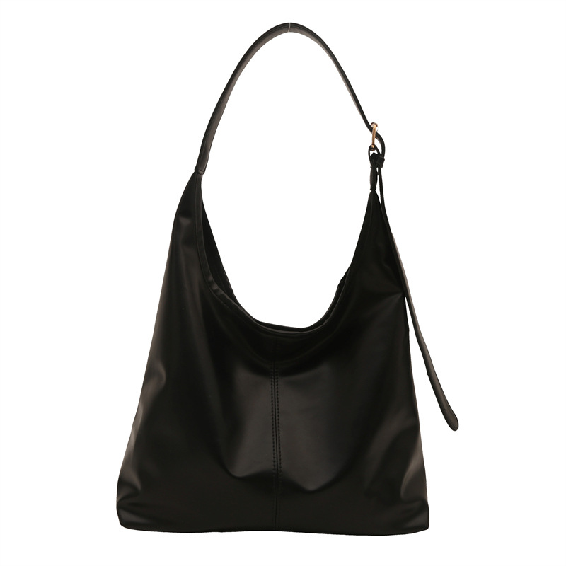 Bolsos de hombro de textura retro de viajes para mujeres 2023 este año, bolsas de brazo coreanas populares, bolsas de moda para mujeres.