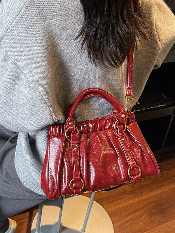 Retro bolso de mano plegable mujer 2025 otoño y invierno nuevo nicho de diseño bolso de cubo de viaje mochila de hombro