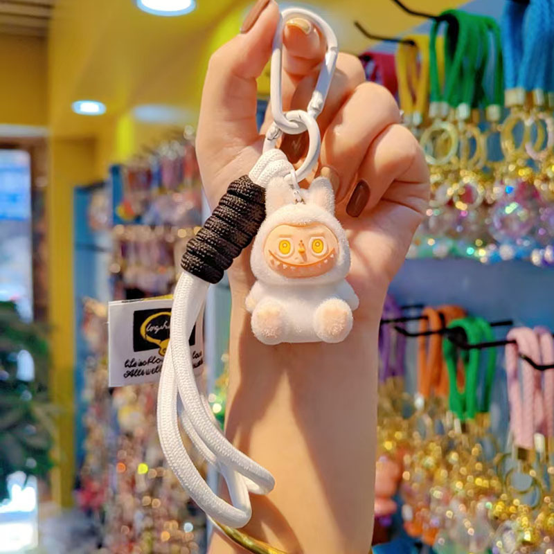 Caricatura floc amarelis llavero de automóvil pareja colgante bolsos creativos colgar garra máquina regalos al por mayor