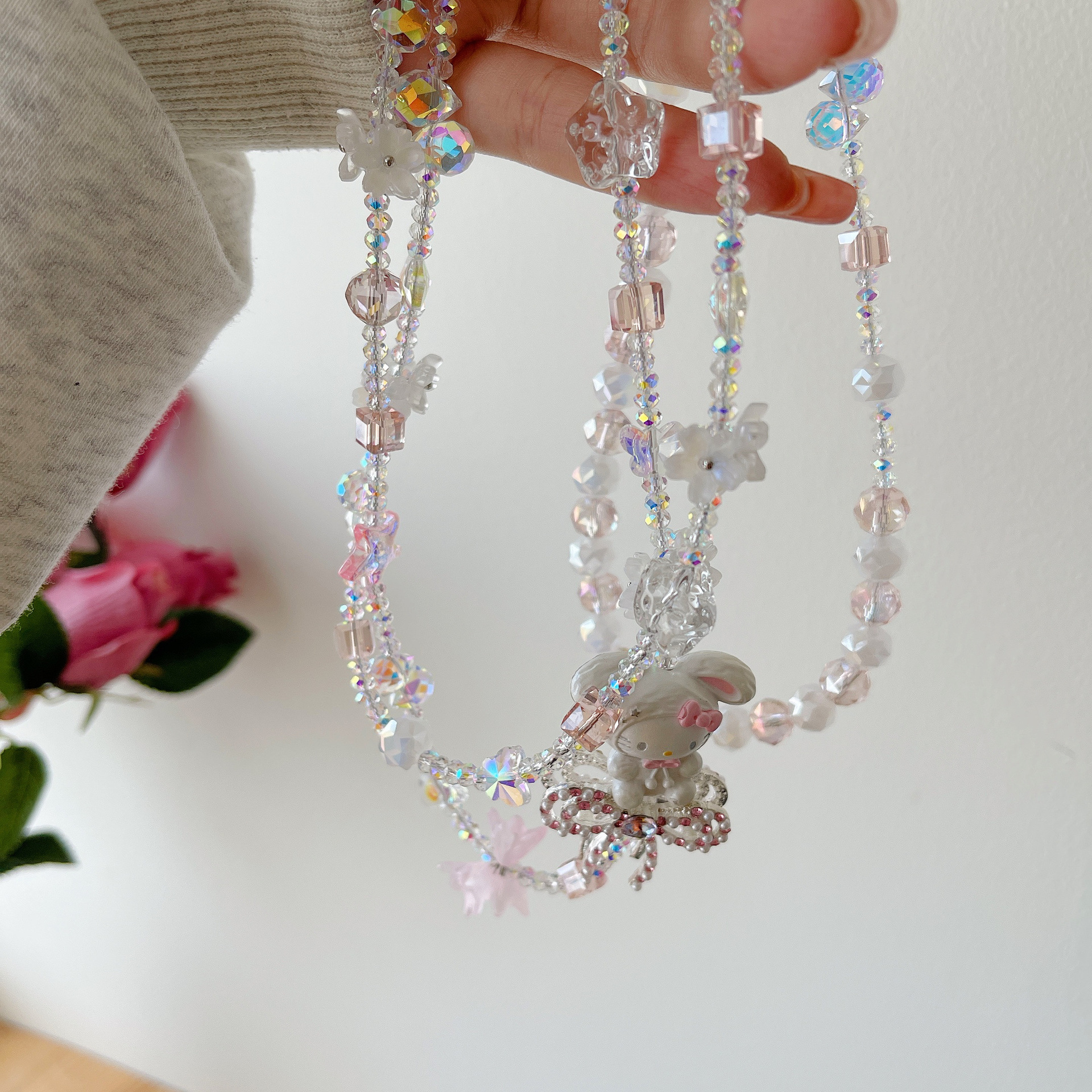 Boutique hecho a mano de alta gama para teléfono móvil cadena larga de gato KT lindo femenino cordón de teléfono móvil de moda colgante de mensajero largo