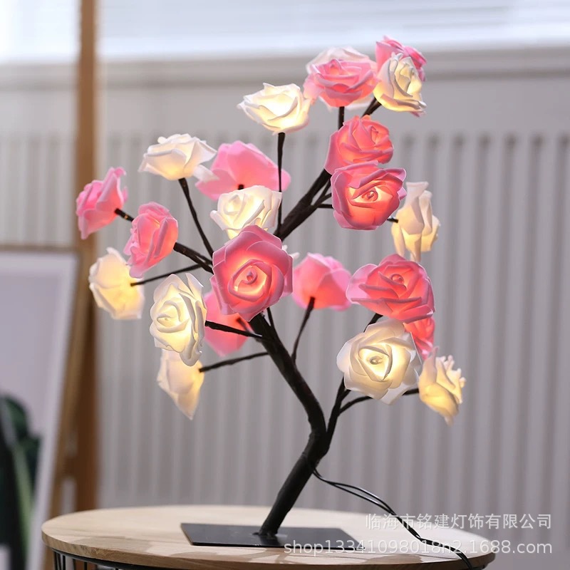 검정색 배경에 24개의 조명 흰색 분홍색 장미