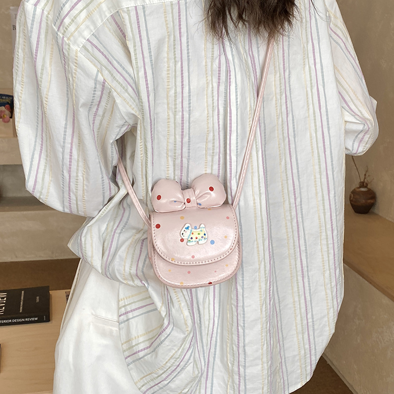2026 nuevo bolso infantil caricatura perrito lindo arco bolso de cambio de moda punto de onda bolso accesorios de niña pequeña