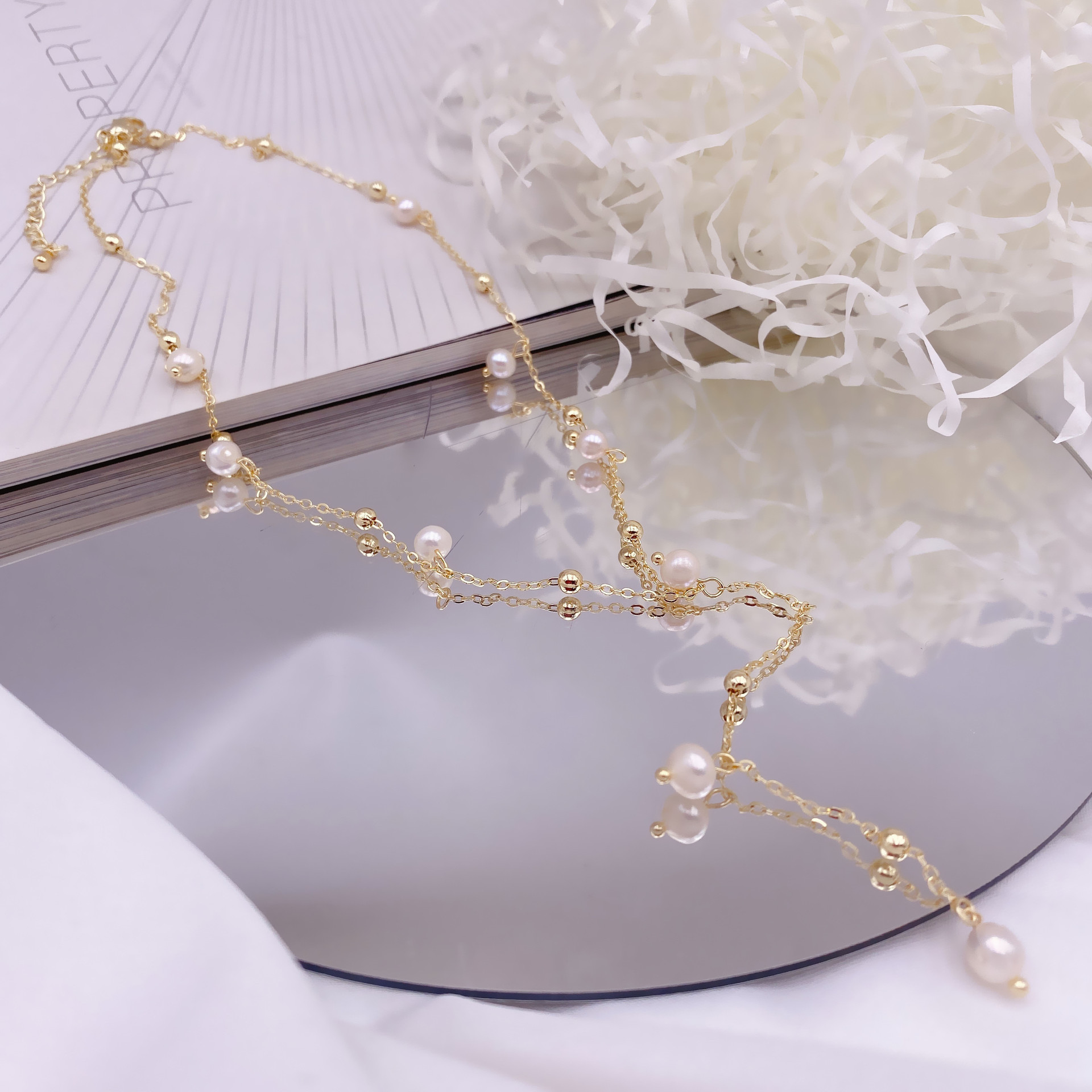 Organic design necklace from pearl with tassels