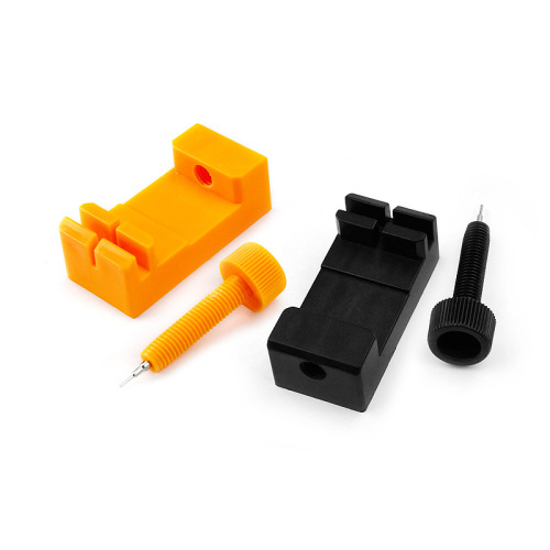 Orange plastic mini watch strap remover tool for adjusting strap length, clock repair tool