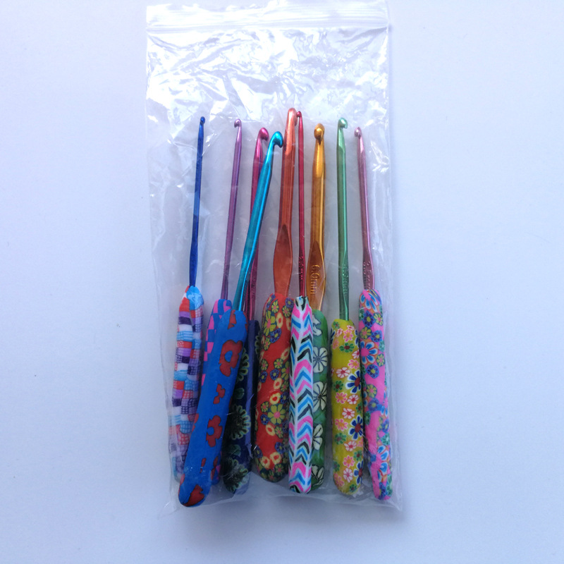 Nuevas herramientas de ganchillo color impresión crochet traje suave cerámica ganchillo 14 unids/set bolso del OPP 14 unids