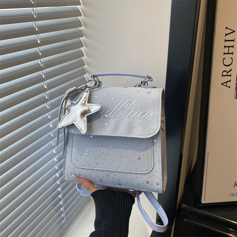 Mochila de moda coreana Full Sky Star 2026 nuevo estilo coreano estilo académico letras versátiles mochila de mano casual