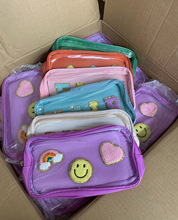 外单笑脸彩虹闪电雪尼尔刺绣化妆包高级感外出便携化妆品洗漱包女