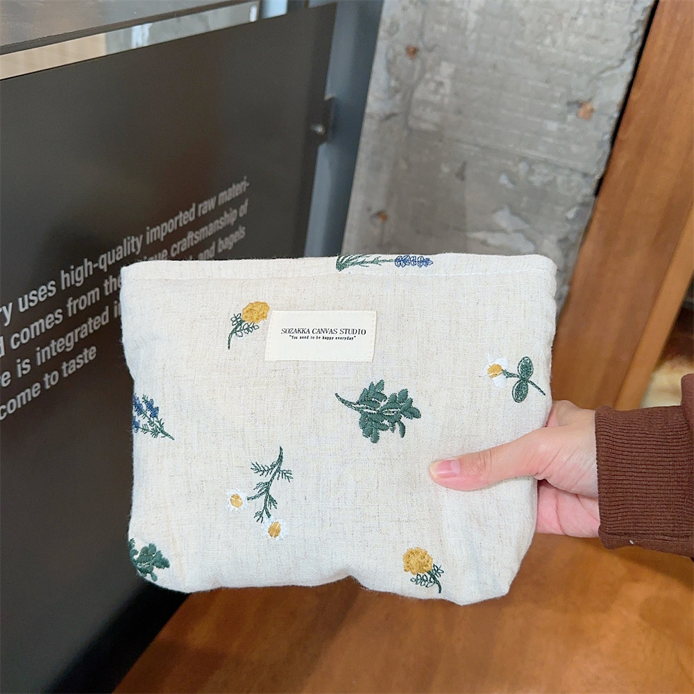 310231 estilo francés nuevo hombro bolsa de algodón ins estilo retro pequeña flor bordada bolsa de cosméticos bolsa de lona portátil