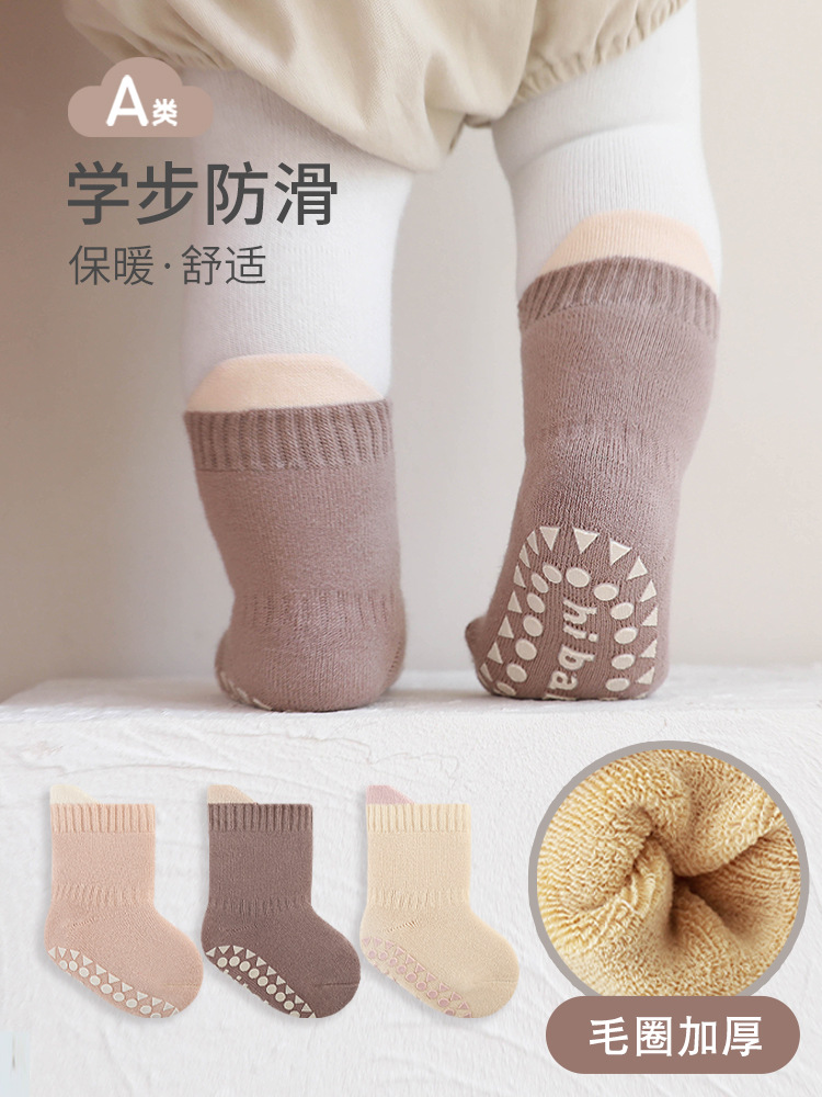 Bebé calcetines de piso otoño e invierno sin hueso engrosado Terry interior antideslizante dispensación niños y niñas niño mediados de la pantorrilla Calcetines