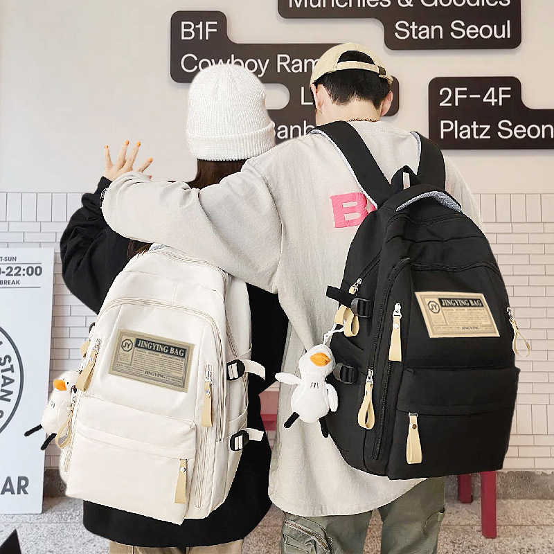 Nueva mochila escolar de estudiantes de secundaria y secundaria de nylon de moda universal mochila casual para hombres y mujeres para viajar mochila de computadora