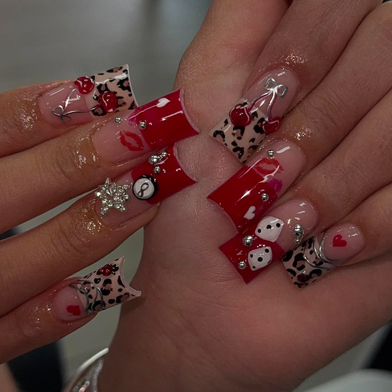 Wearable nail art pieces for export to Europe and the US: red leopard print, 3D cherry, billiard dice, red lips, heart-shaped rhinestones, and nail art decorations – available for wholesale Wearable nail art pieces for export to Europe and the US: red leopard print, 3D cherry, billiard dice, red lips, heart-shaped rhinestones, and nail art decorations – available for wholesale
