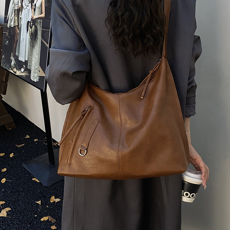 Bolsa de viaje retro de alta calidad para mujeres 2025 invierno nuevo estilo de moda multifuncional bolso de hombro de textura de moda bolso de brazo