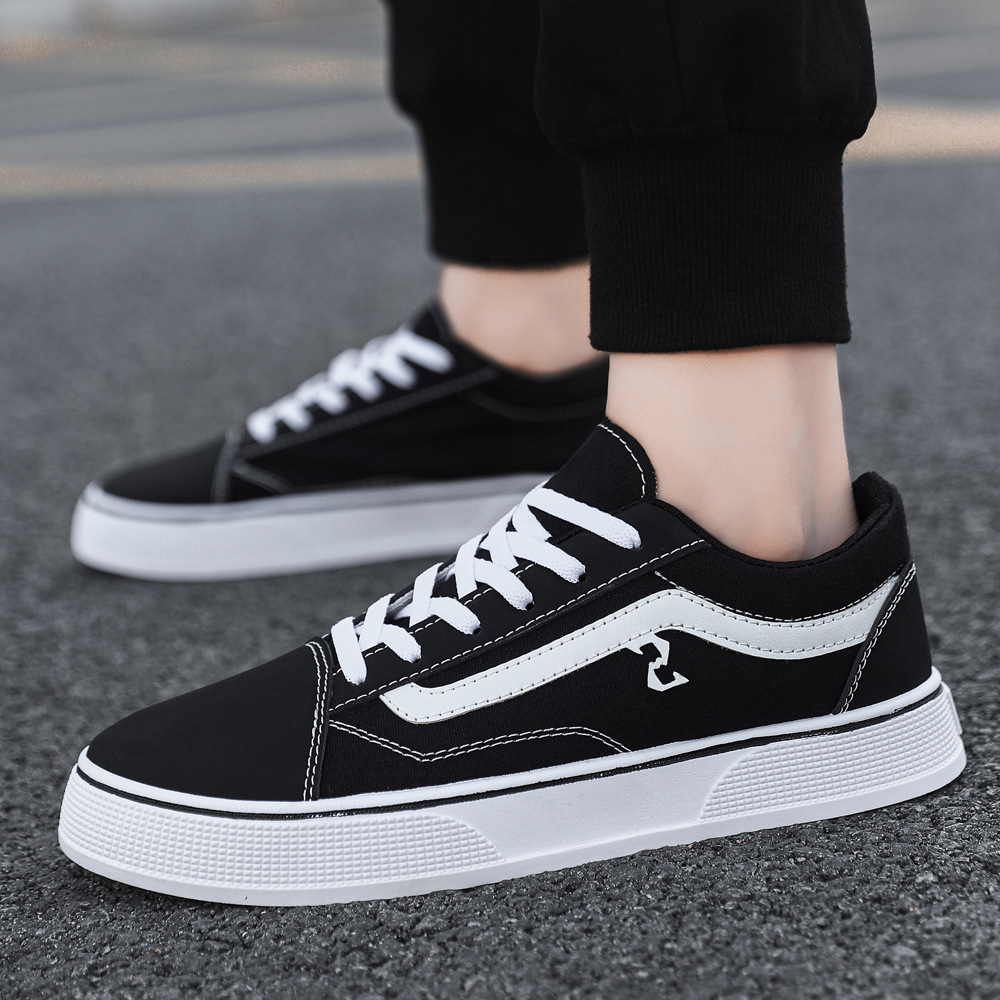 Zapatos de lona de otoño nuevos zapatos casuales transpirables bajos zapatos escolares clásicos coreanos zapatos de tela a cuadros negros zapatos de skate para hombres