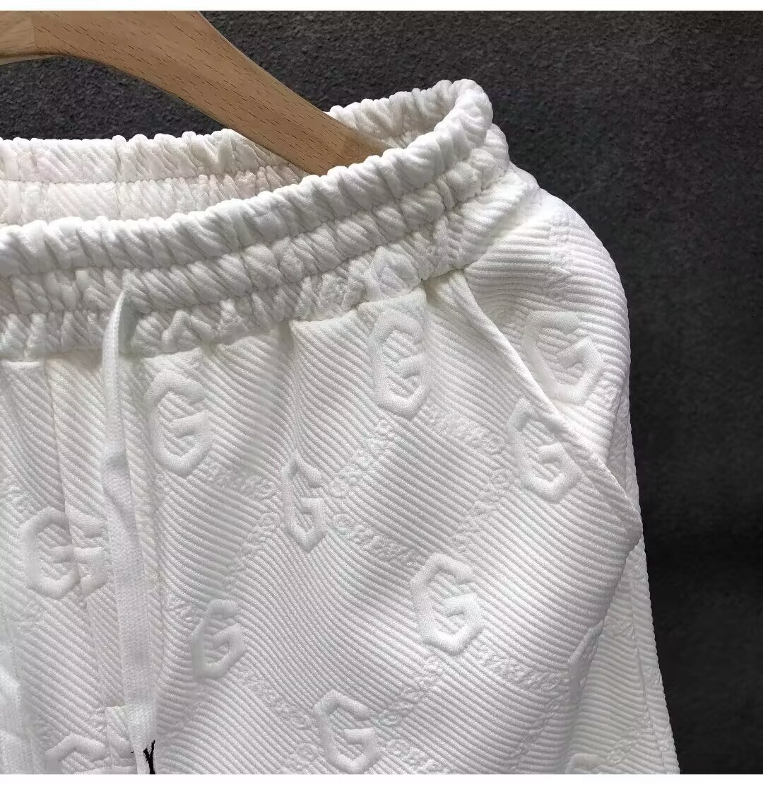 Pantaloncini bianchi jacquard alla moda con lettera G per pantaloni sportivi dritti larghi a cinque divisi estivi a nido d'ape da uomo_voghion.com
