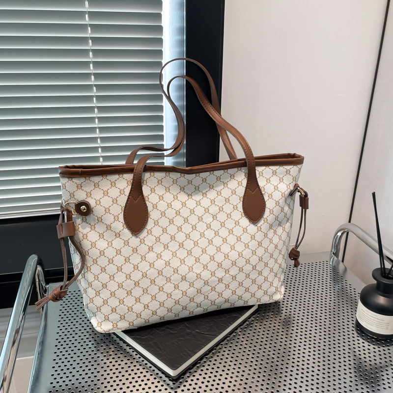 Bolso grande con sensación de relajación 2025 nuevo bolso de hombro impreso de moda de moda bolso de viaje de trabajo bolso de alta capacidad