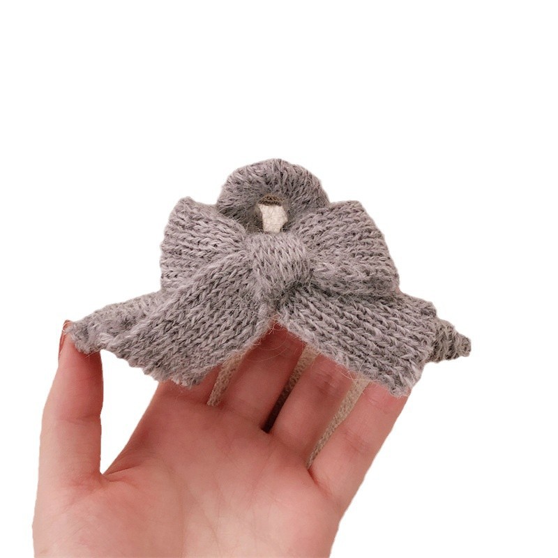 Otoño y invierno nuevo arco lana de punto pinzas de cabello de alta sensación otoño y invierno tocado de Año Nuevo rascar pinzas de pescado para mujeres