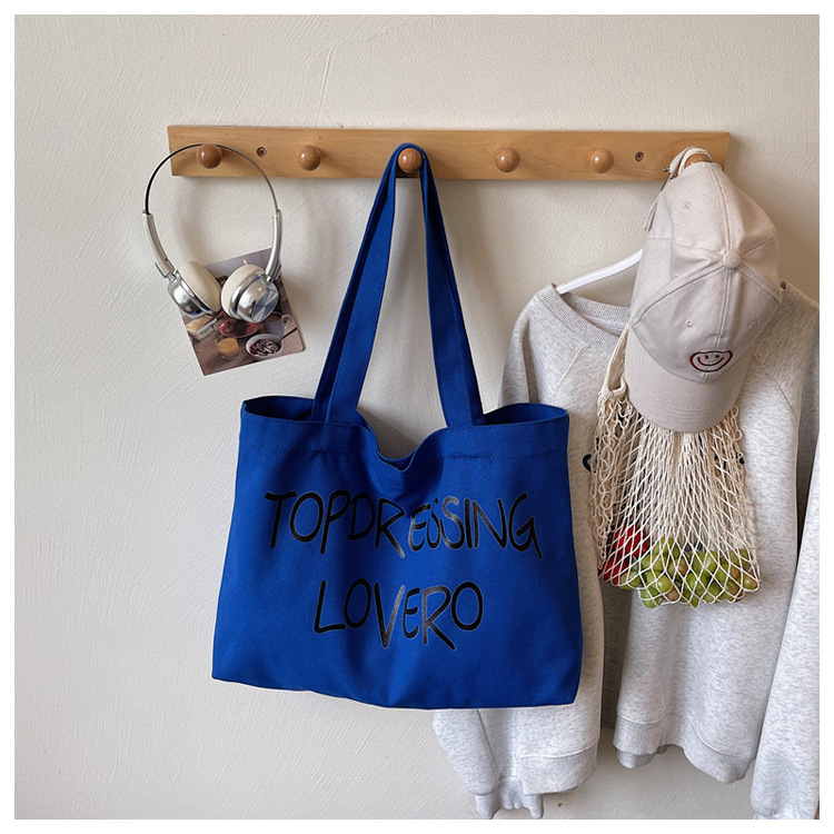 Bolsas coreanas de gran capacidad para mujeres 2026 nuevas letras de impresión de moda bolsas axilales de hombro para viajar bolsas de ocio