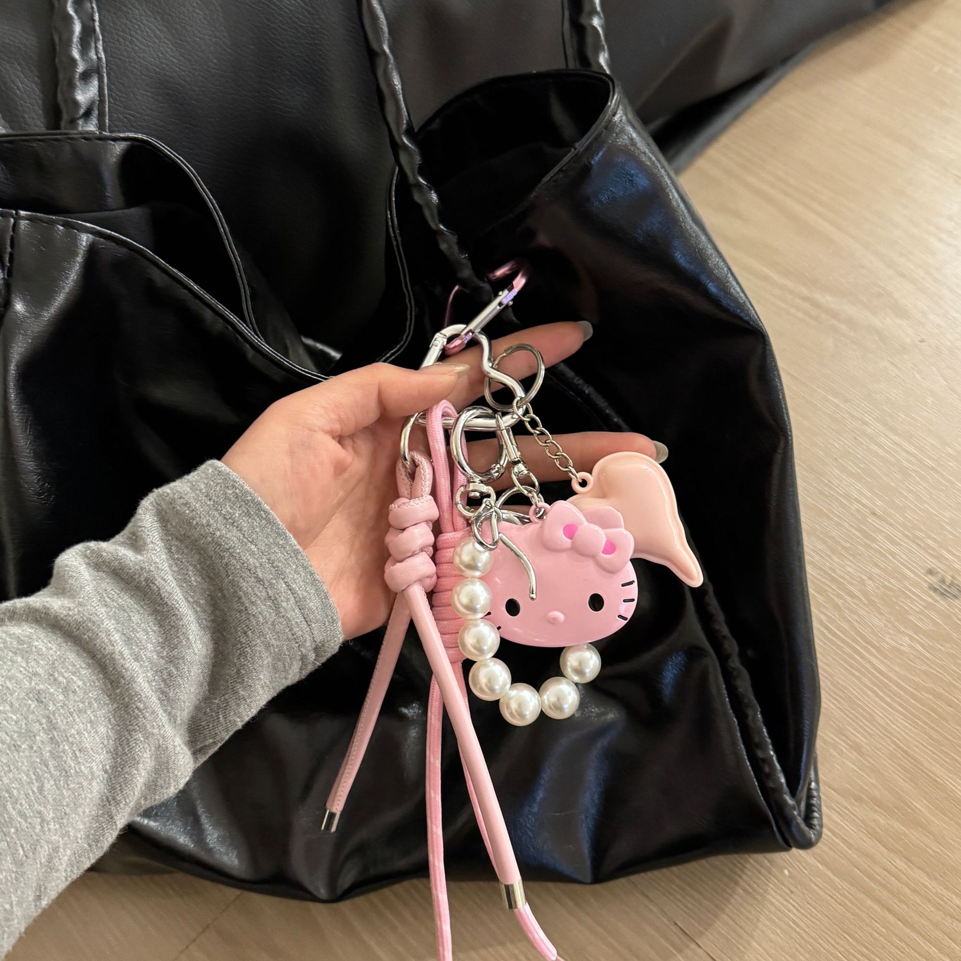 Original DIY hecha a mano colgante rosa KT gato personalidad bolso colgante Miu pareja trenzado colgante bolso colgante