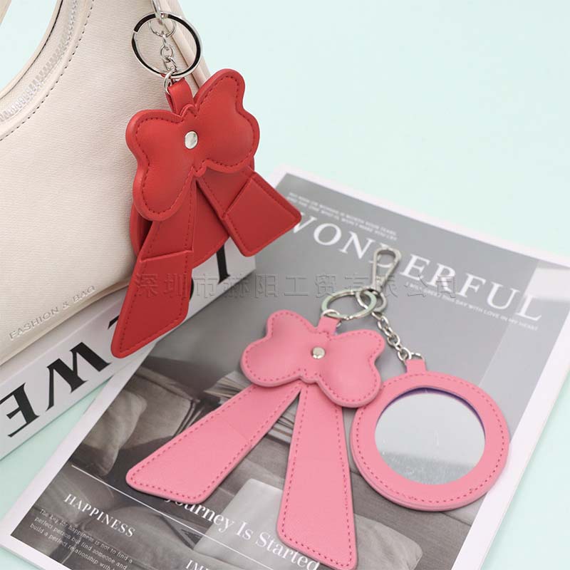 Cross-border bestseller: Cute bow-shaped makeup mirror keychain, portable makeup mirror pendant, lipstick storage bag