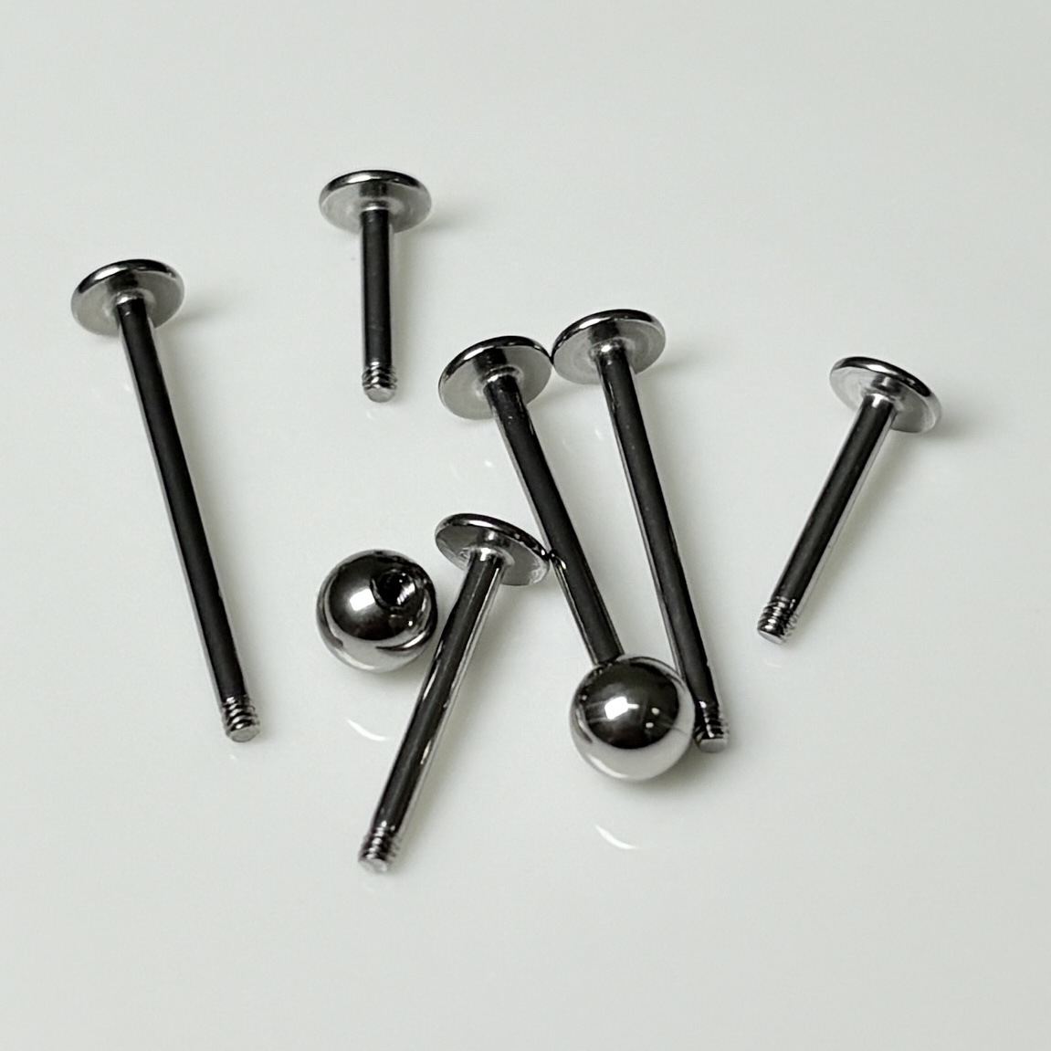 Silver pointed spike labret stud material detail