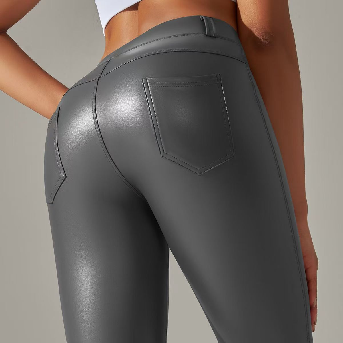 2024 Europa y América Pantalones de cuero PU mujeres de cintura alta ajustados pantalones de bolsillo molido leggings nuevo otoño invierno