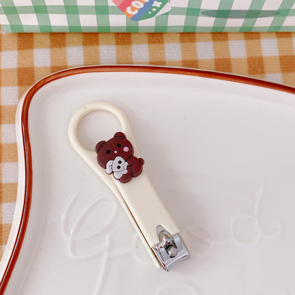 Mini lindo cortaúñas anti-salpicaduras para el hogar de una sola historieta creativa plegable cortaúñas manicura reparación