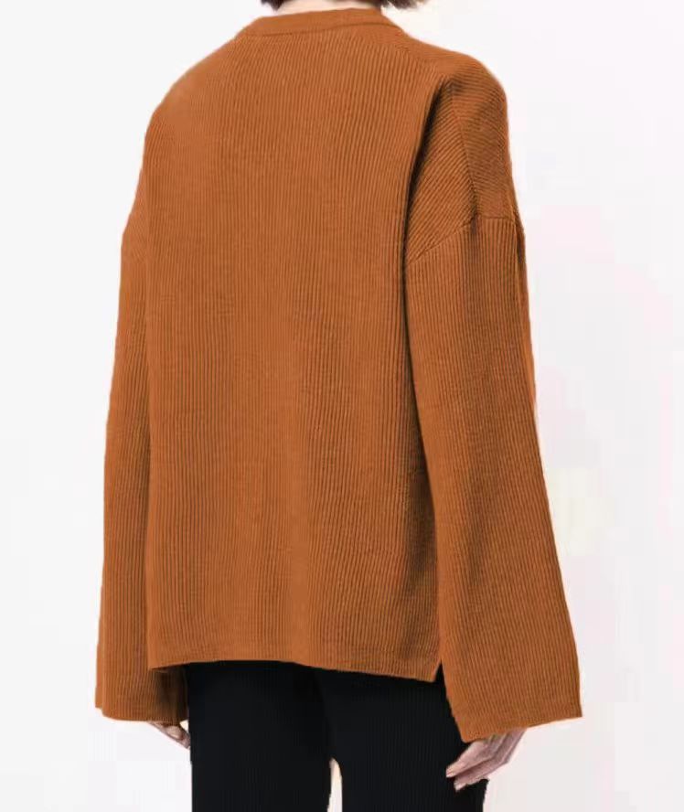 Women's all-in-one solid color three-button long sleeve loose side slit knit sweater_voghion.com