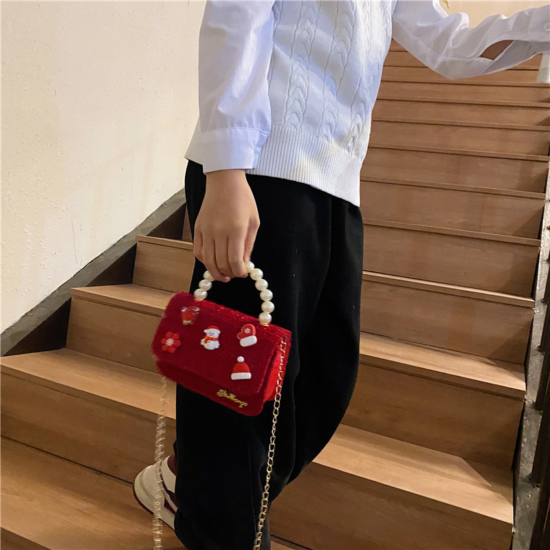 Mini moda para niñas bolso de cambio de perlas 2024 nuevo patrón de moda coreana bolso de ropa infantil