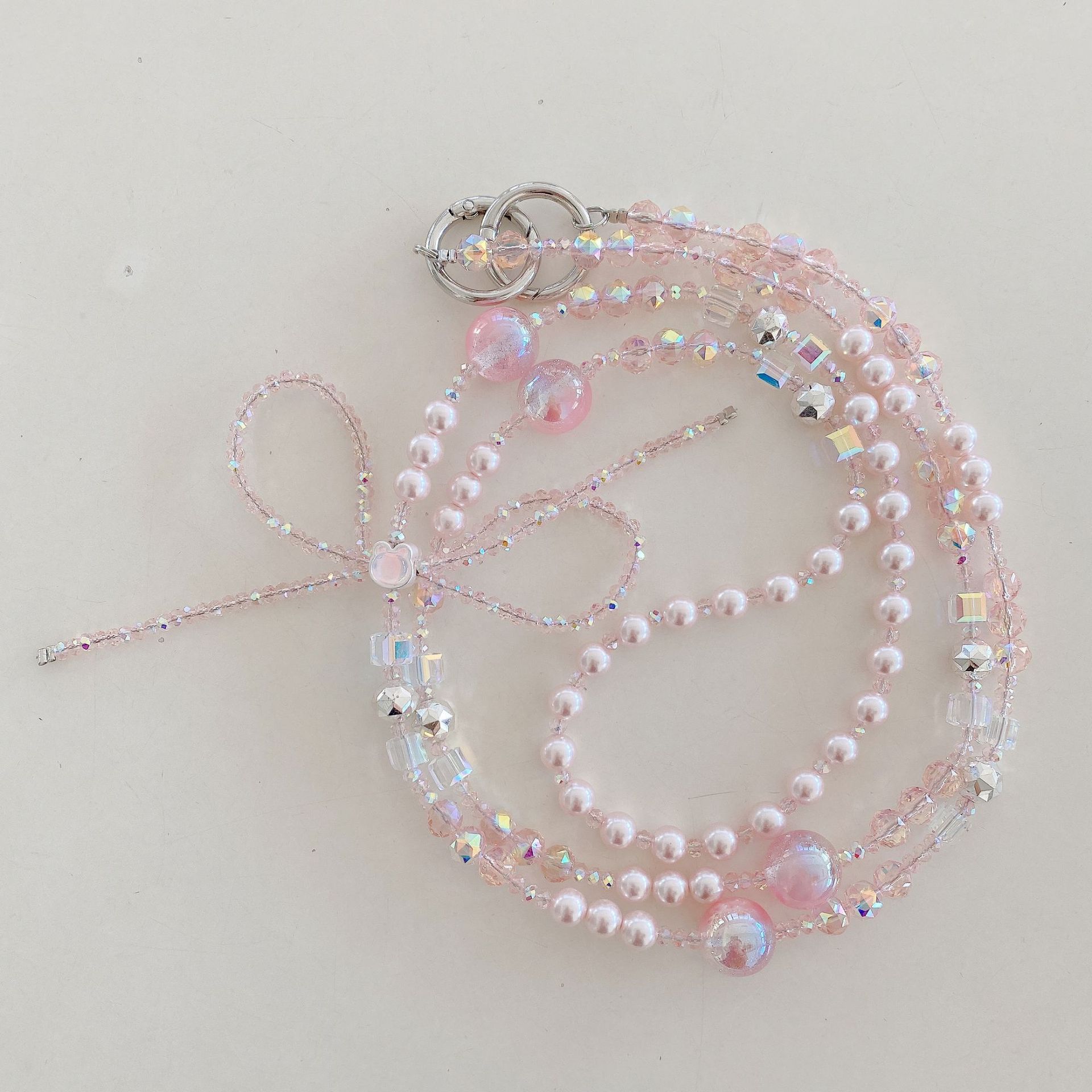 Boutique hecho a mano cadena colgante de alta gama arco fresco de cuatro colores cadena larga cordón de teléfono móvil de moda mensajero largo/colgante