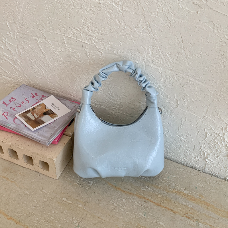 2026 primavera nueva moda temperamento bolso de hombro de moda bolso de arco de moda moda bolso de mano de tendencia diaria plegado mochila